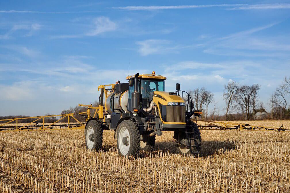 Harriston Agromart agricultural machinery working on wheat crop