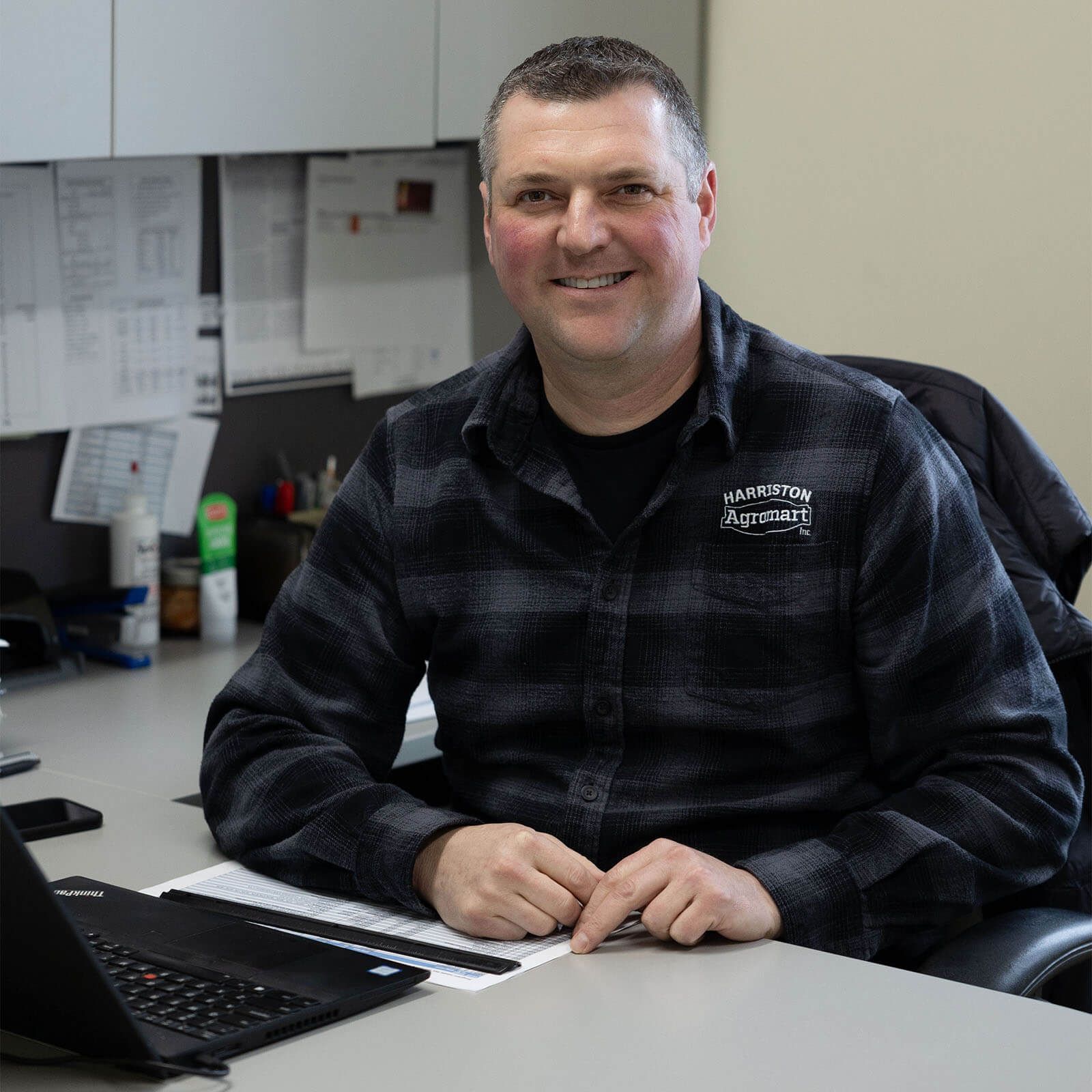 Jeff Jacques at desk at Harriston Agromart office